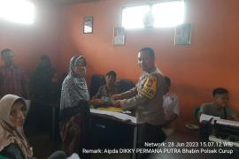 Bhabinkamtibmas Polsek Curup Hadiri Penyaluran BLT DD di Desa Pungguk Lalang