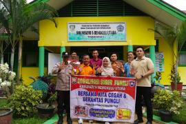 Cegah Pungli di Sekolah, Bhabinkamtibmas Sosialisasi Kepada Guru